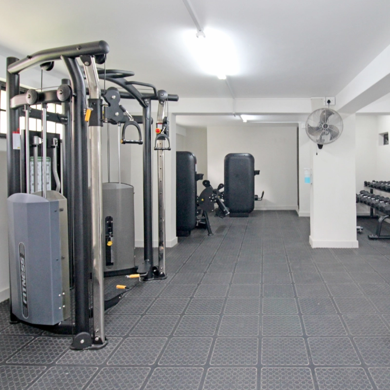 Interior of a gym with exercise equipment and weights